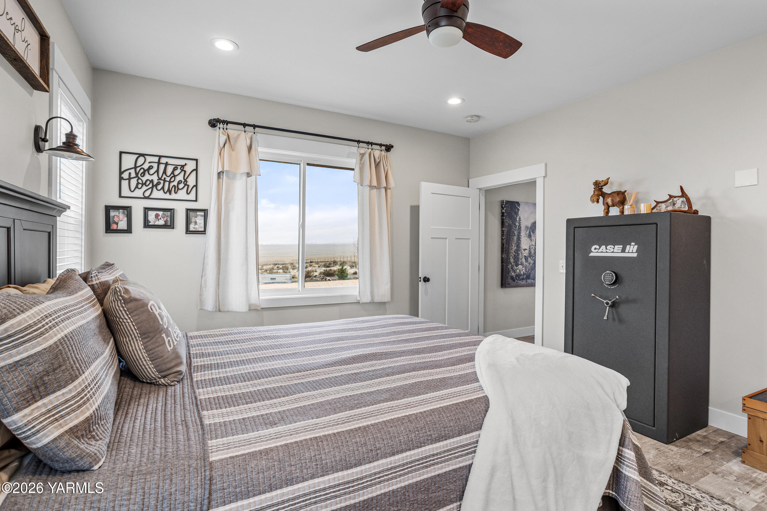 517 Game Ridge Road Selah, WA 98942 - Photo 26 of 72 a bedroom with a bed and a window
