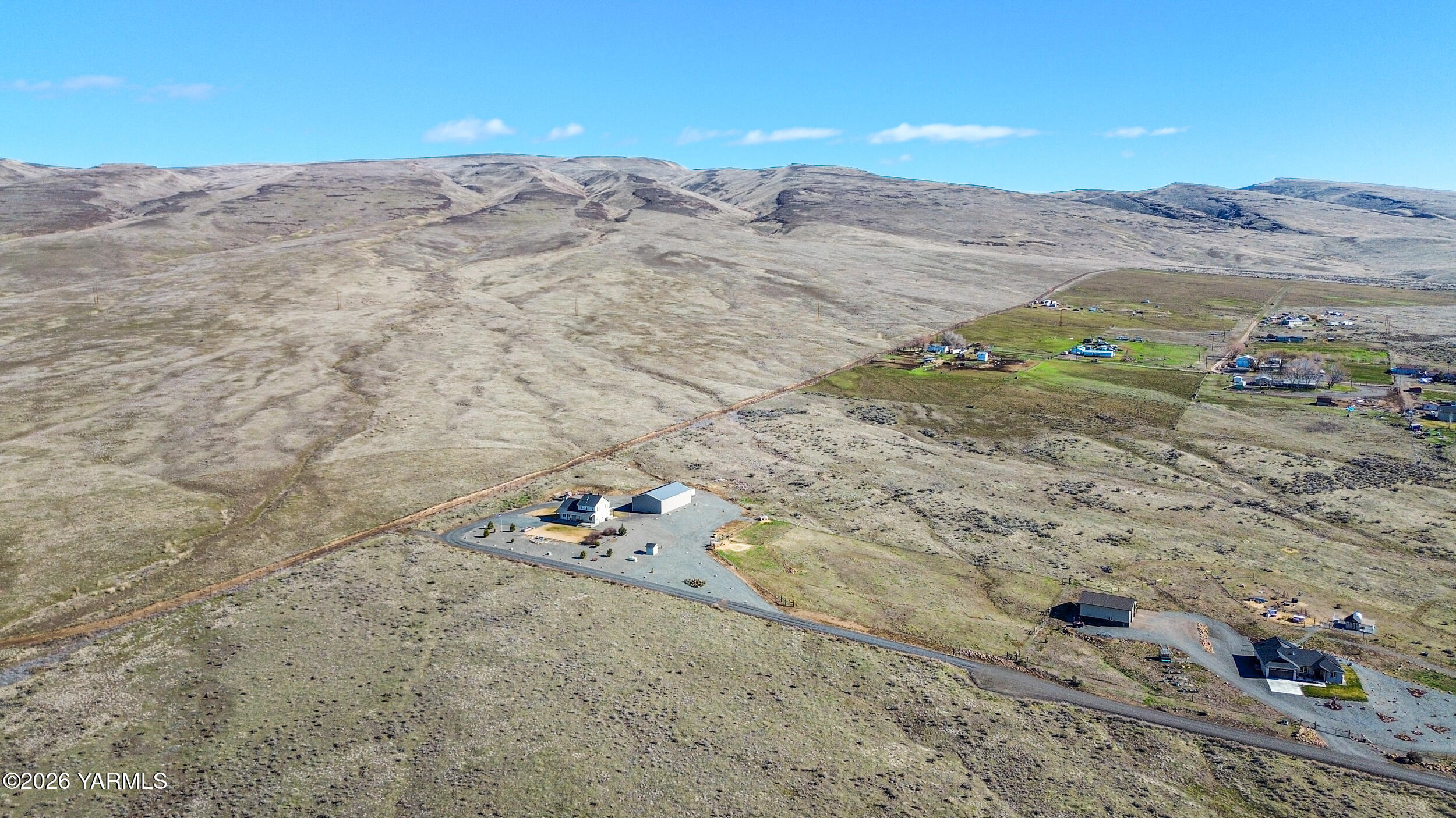 517 Game Ridge Road Selah, WA 98942 - Photo 57 of 72 a view of a dry field with mountains in the background