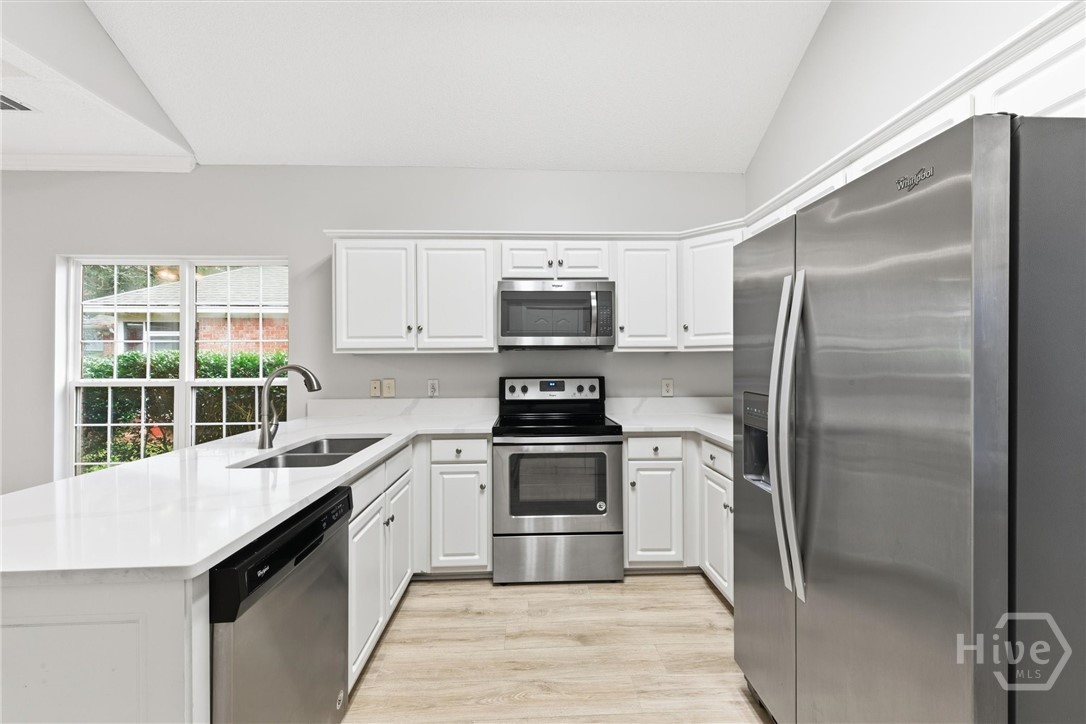 11 Wild Heron Villas Road Savannah, GA 31419 - Photo 11 of 45 The kitchen offers abundant white cabinetry.