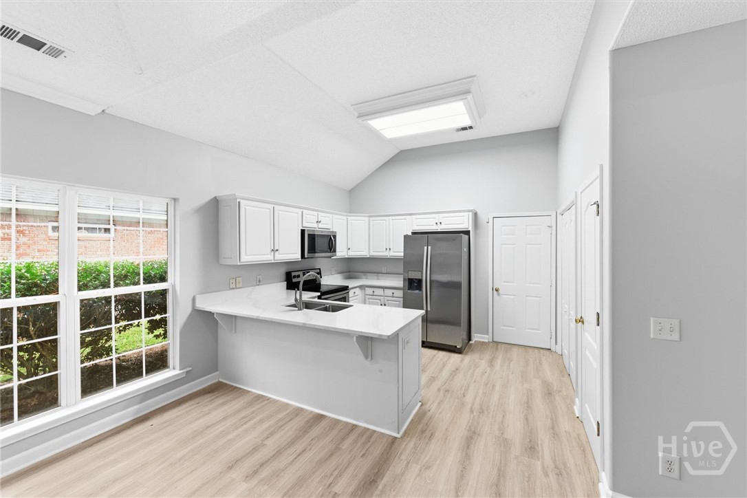 11 Wild Heron Villas Road Savannah, GA 31419 - Photo 10 of 45 The great room is open to the kitchen.