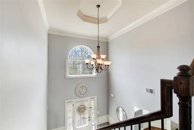 a view of a hallway with paintings on the wall