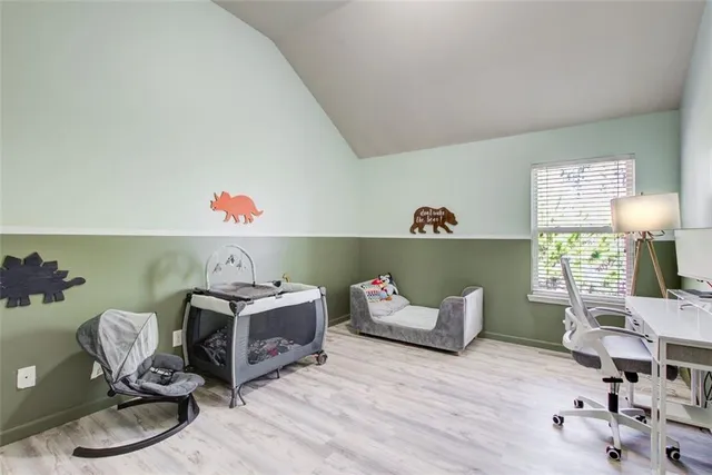 a room with furniture and a wooden floor