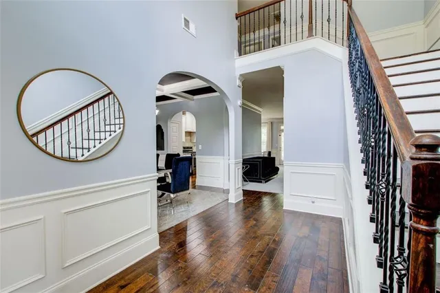 a view of a livingroom with furniture and hardwood floor