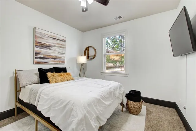 a bedroom with a bed and a window