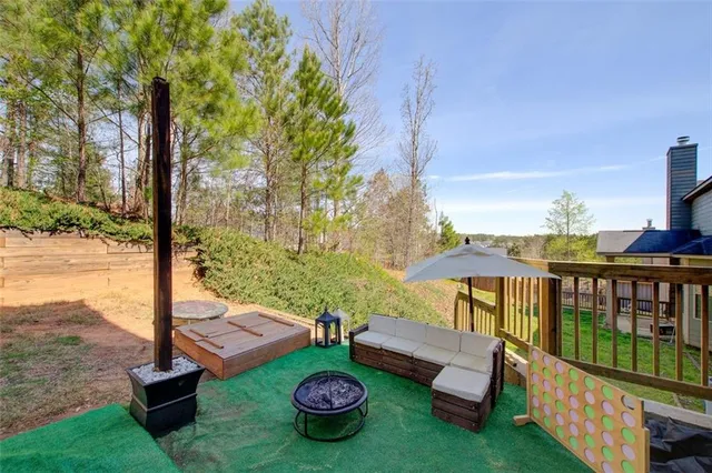 a view of a patio with chairs and a table