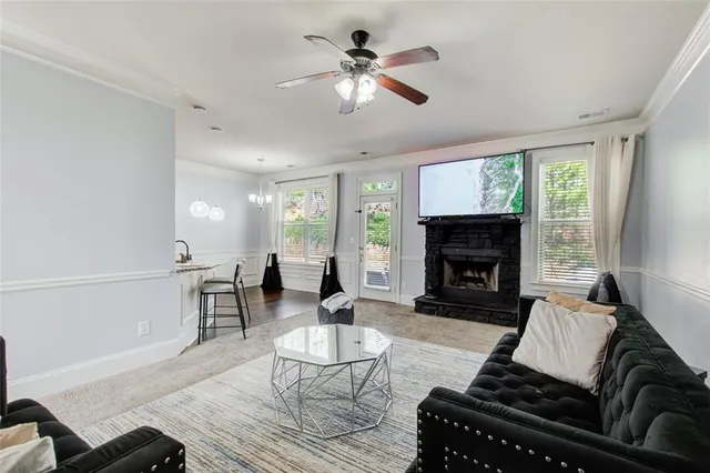 a living room with furniture fireplace and window