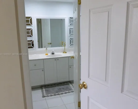 a bathroom with a sink and mirror