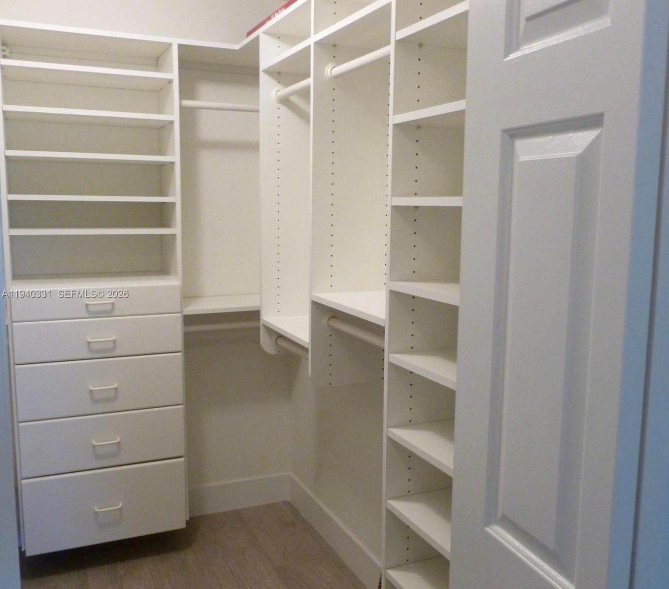 16300 Golf Club Road, Unit 203 Weston, FL 33326 - Photo 6 of 11 a view of an empty walk in closet