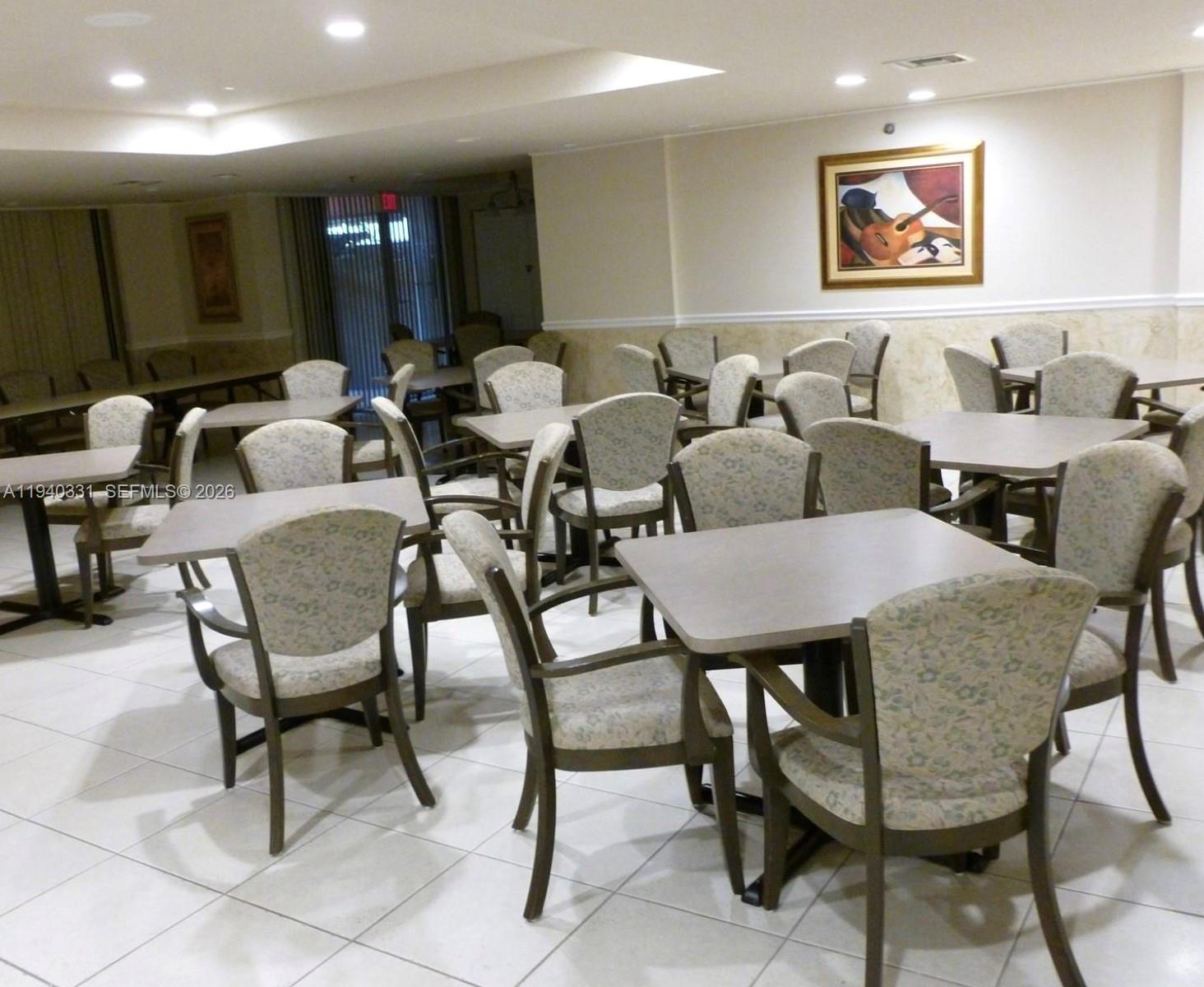 16300 Golf Club Road, Unit 203 Weston, FL 33326 - Photo 10 of 11 a view of a dining room with furniture