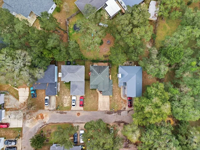 an aerial view of residential houses with outdoor space