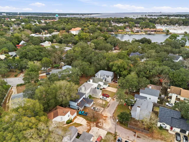 an aerial view of a houses with a lake view