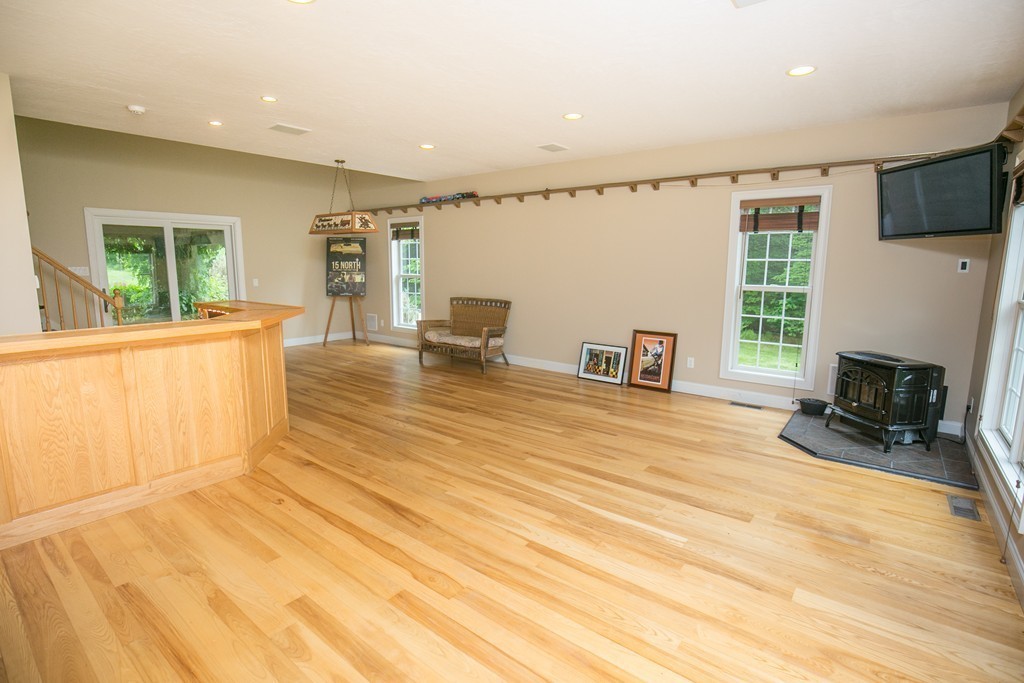 41 Montague Road Westhampton, MA 01027 - Photo 16 of 30 a view of an empty room with a fireplace and a window