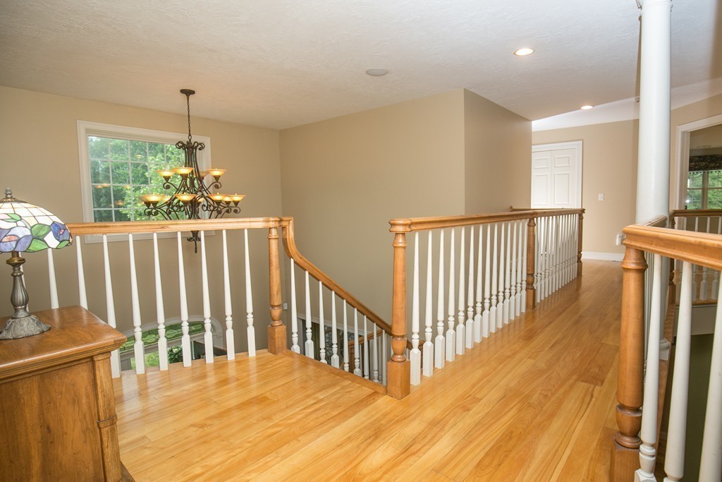 41 Montague Road Westhampton, MA 01027 - Photo 18 of 30 a view of a room with wooden floor windows and a chandelier