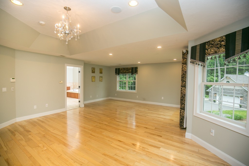 41 Montague Road Westhampton, MA 01027 - Photo 24 of 30 a view of an empty room with wooden floor and a window