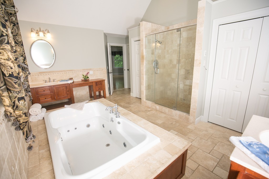 41 Montague Road Westhampton, MA 01027 - Photo 25 of 30 a spacious bathroom with a tub sink and mirror