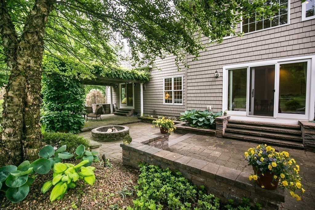 41 Montague Road Westhampton, MA 01027 - Photo 27 of 30 a backyard of a house with wooden floor and outdoor seating