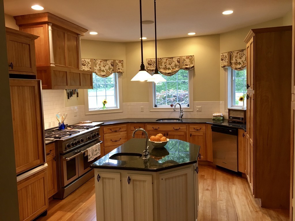 41 Montague Road Westhampton, MA 01027 - Photo 6 of 30 a kitchen with stainless steel appliances granite countertop a stove a sink and a refrigerator