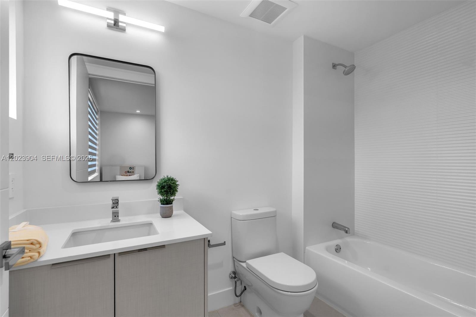 721 Southwest 11th Street, Unit G Miami, FL 33129 - Photo 25 of 40 a bathroom with a sink toilet and shower