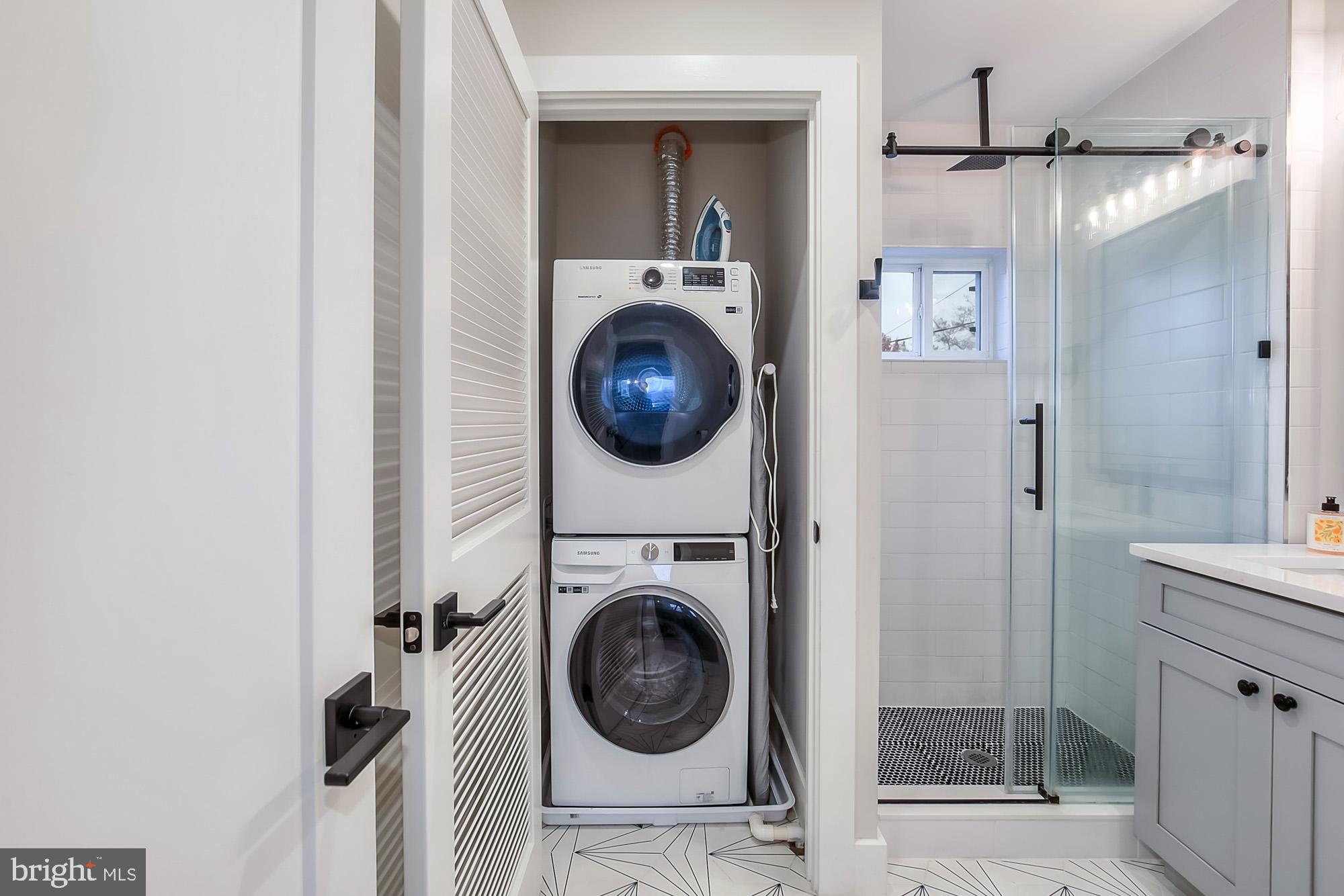 501 Longfellow Street Northwest, Unit B Washington, DC 20011 - Photo 13 of 22 a view of a hallway with washer and dryer