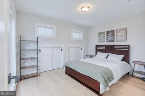a bedroom with a bed and a cabinets