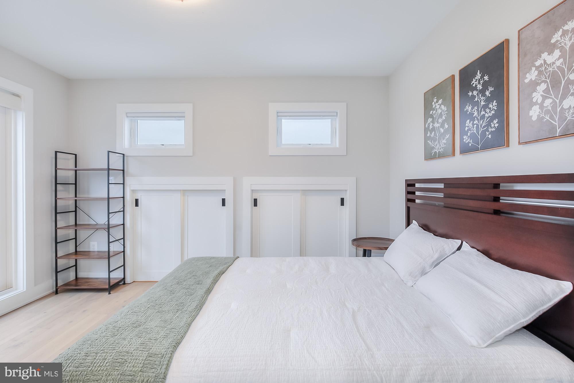 501 Longfellow Street Northwest, Unit B Washington, DC 20011 - Photo 16 of 22 a bedroom with a bed and a cabinets