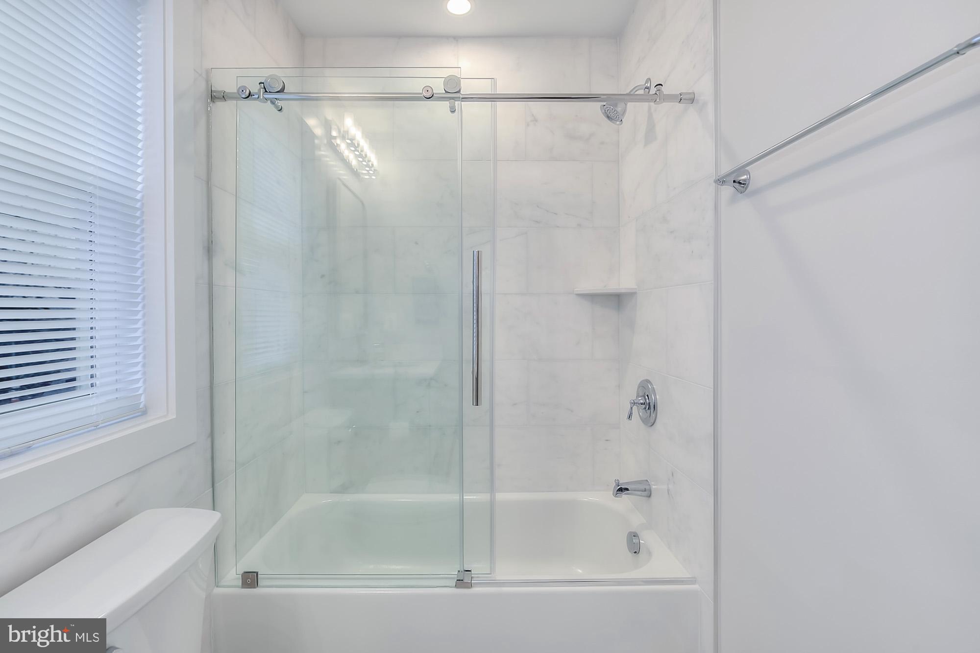 501 Longfellow Street Northwest, Unit B Washington, DC 20011 - Photo 21 of 22 a bathroom with a shower and a toilet