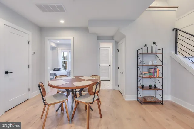 a view of a room with furniture and wooden floor