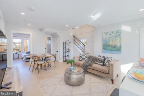 a living room with furniture and a table