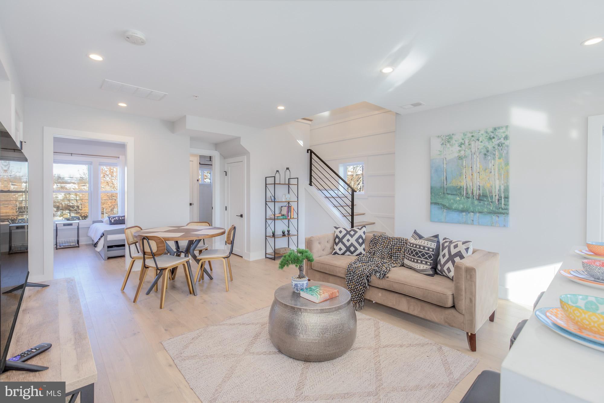 501 Longfellow Street Northwest, Unit B Washington, DC 20011 - Photo 6 of 22 a living room with furniture and a table