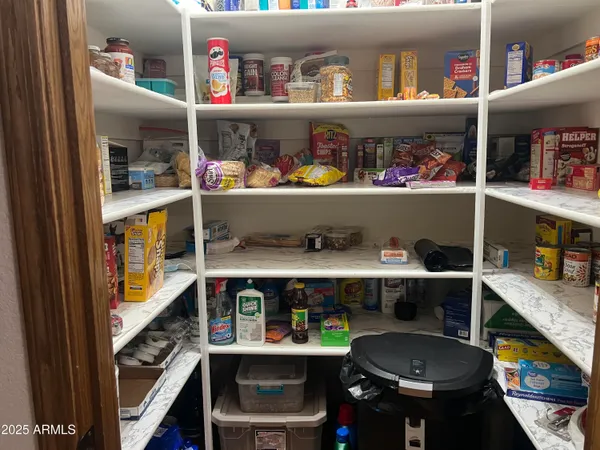 a room with lots of different kinds of food