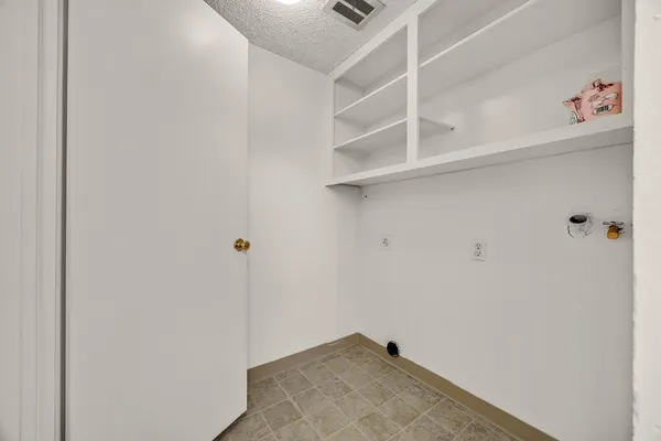 a view of a hallway with closet