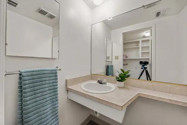 a bathroom with a sink and a mirror