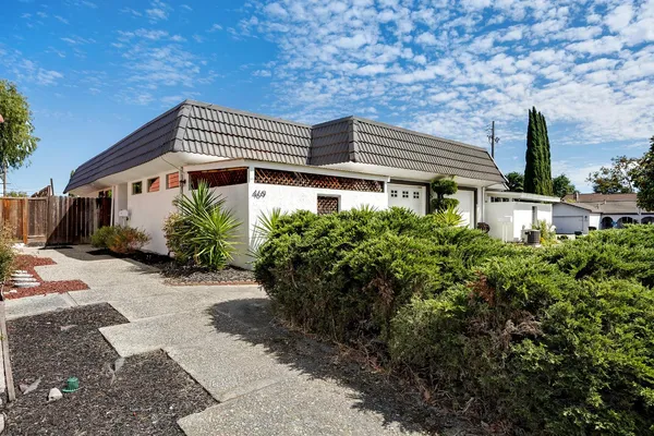a front view of a house with garden