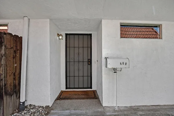 a view of a hallway with entryway doors