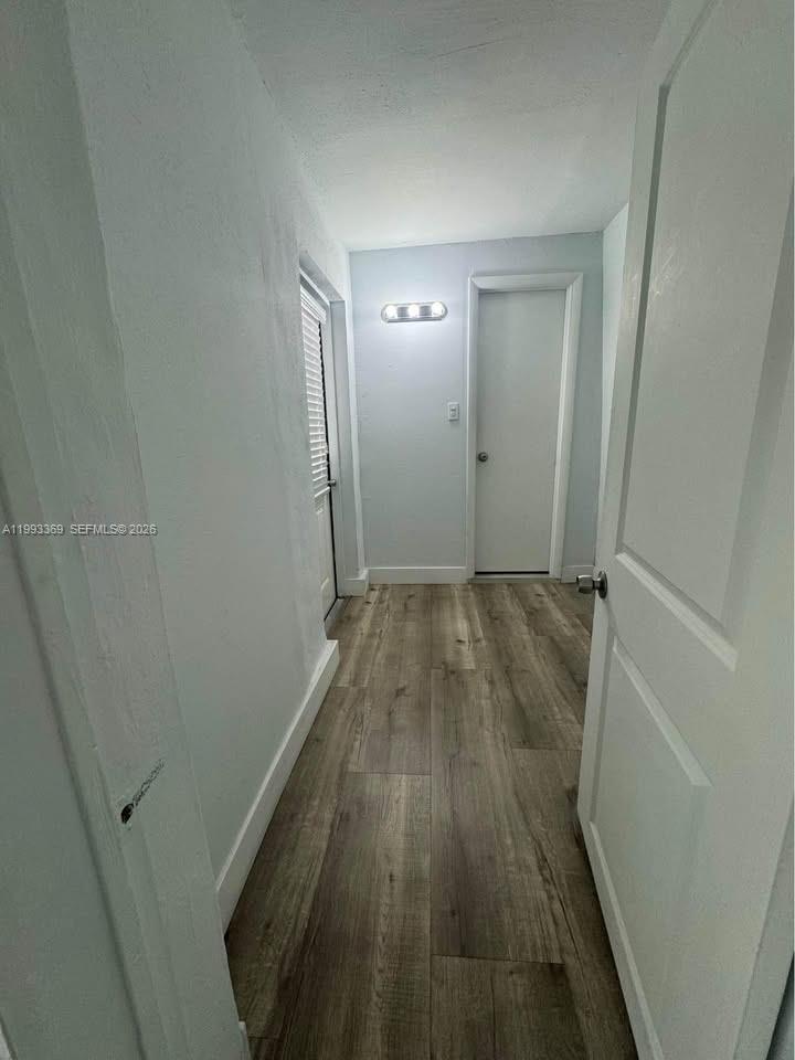 7620 Southwest 21st Street, Unit 2 Miami, FL 33155 - Photo 4 of 5 a view of wooden floor