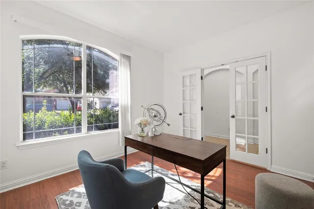 a living room with furniture a table and a window