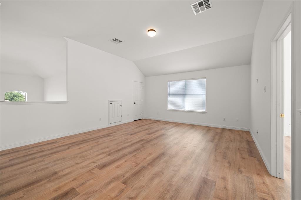 3664 Rosalina Loop Round Rock, TX 78665 - Photo 14 of 22 an empty room with wooden floor and windows