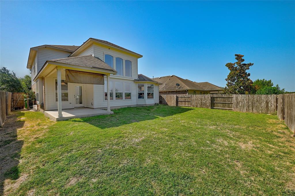 3664 Rosalina Loop Round Rock, TX 78665 - Photo 19 of 22 a front view of a house with garden