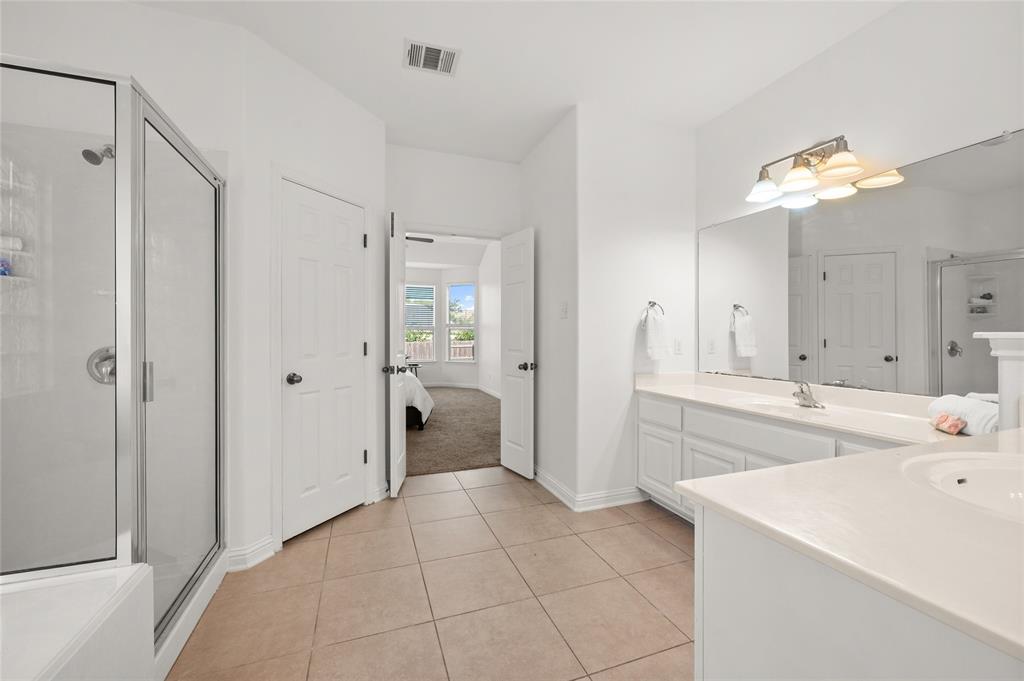 3664 Rosalina Loop Round Rock, TX 78665 - Photo 10 of 22 a large white kitchen with a sink and refrigerator