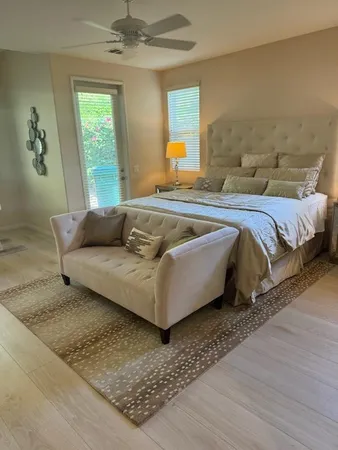 a bedroom with a bed and window