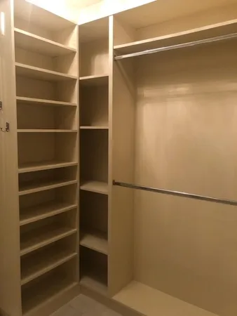a bathroom with a bathtub sink and mirror