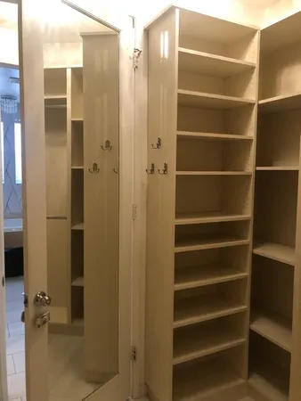 a room with a wooden floor and a wall