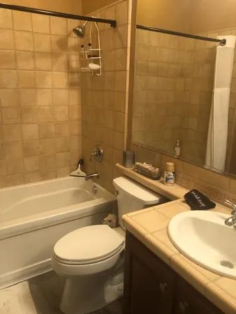 a view of a terrace with couches and potted plants