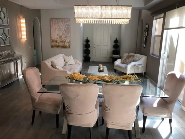 a dining room with furniture and window