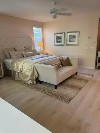 a bedroom with a bed and a couch