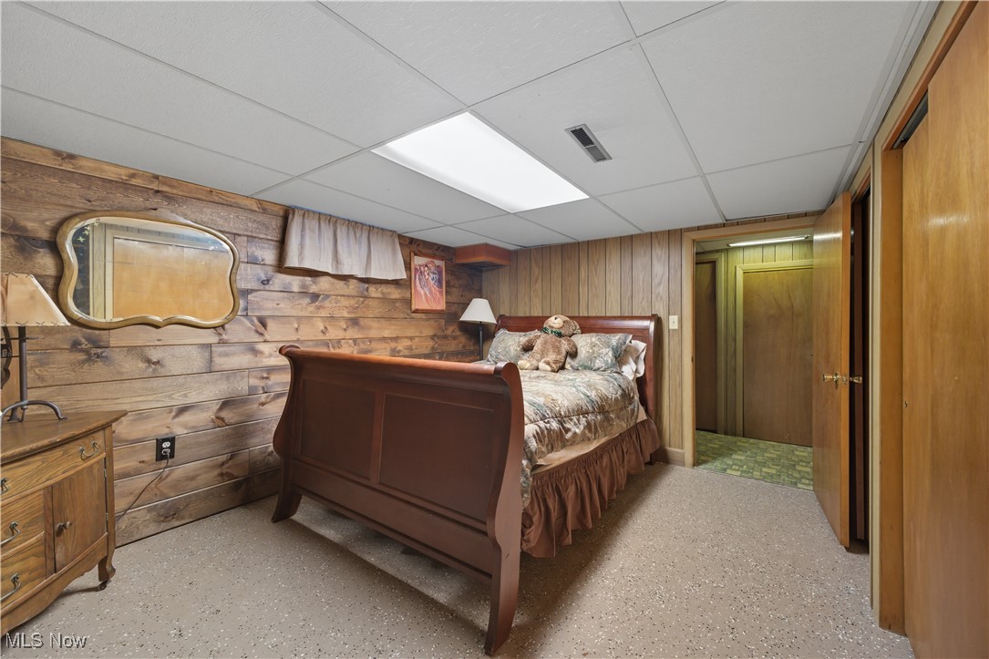 31085 Georgetown Road Salem, OH 44460 - Photo 27 of 50 Bedroom featuring a paneled ceiling and wood walls