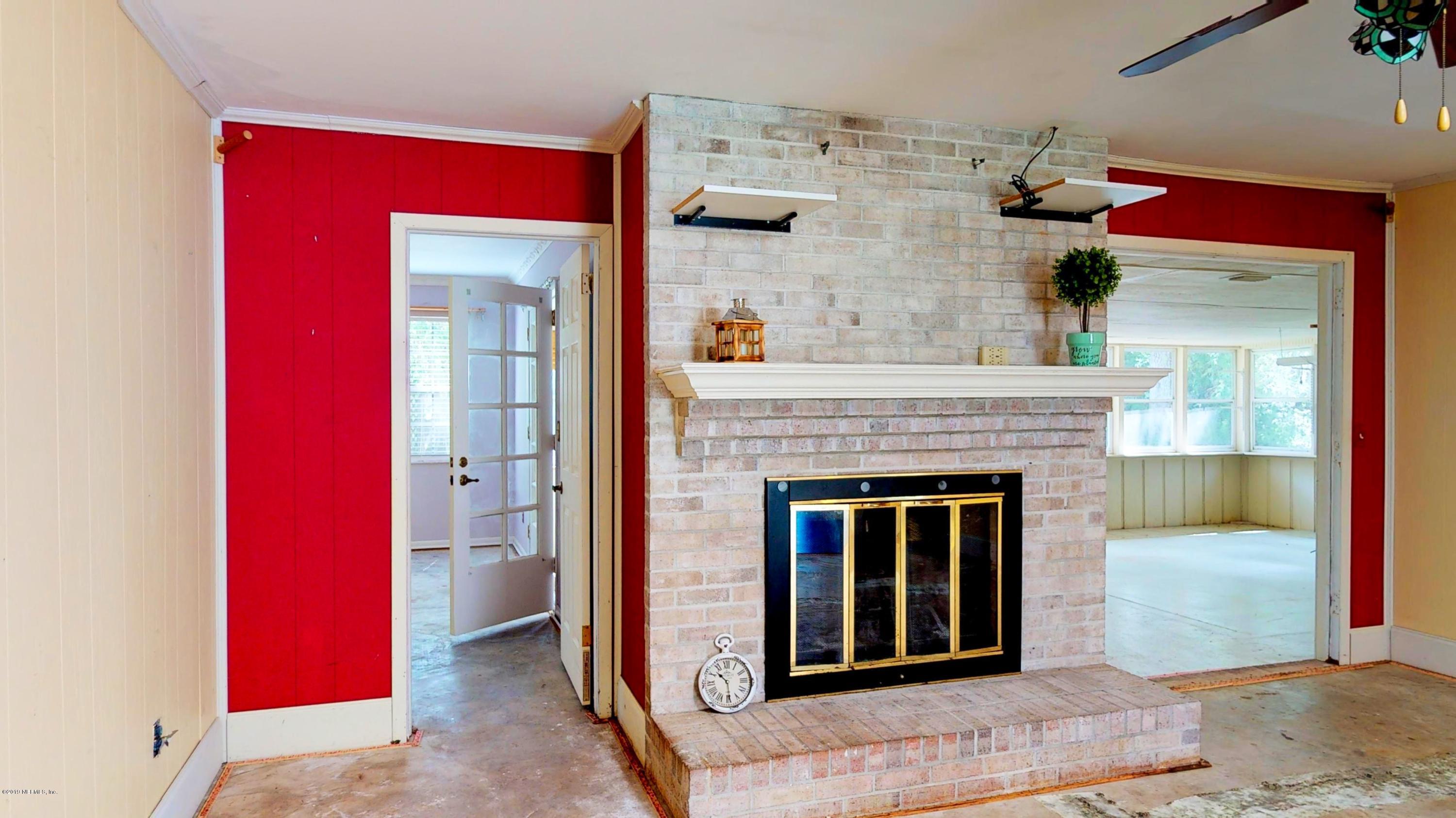 2980 Oak Road Orange Park, FL 32065 - Photo 3 of 37 Fireplace to Florida Room and Master