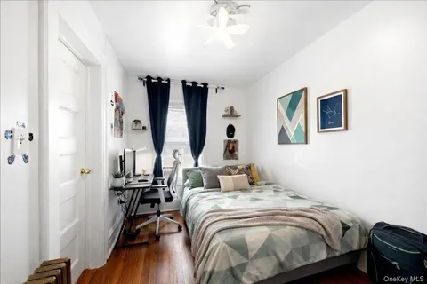 a bedroom with bed and a window