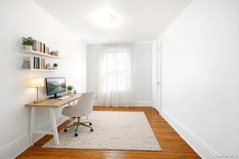a workspace with furniture and a rug