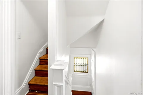 a view of an entryway with wooden floor